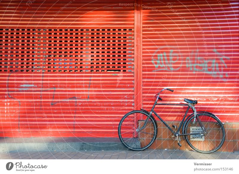Fiets, he's sleeping. Bicycle Parking Red Black Metal Facade Sidewalk Graffiti Light Shadow Disk Slat blinds Netherlands Traffic infrastructure Beautiful Winter