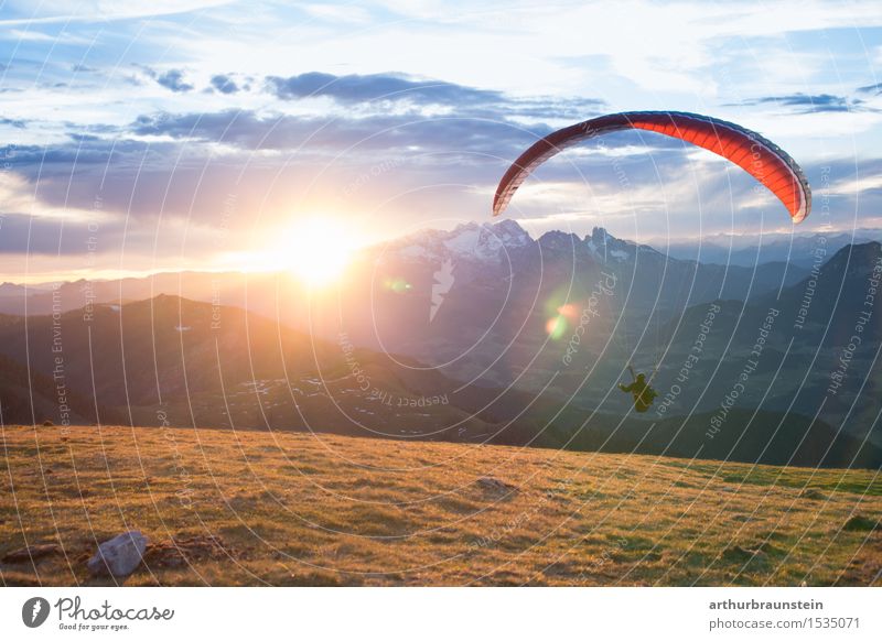 Paragliding at sunrise Lifestyle Athletic Leisure and hobbies Freedom Mountain Hiking Sports Extreme sports Paraglider Human being Masculine Feminine Woman