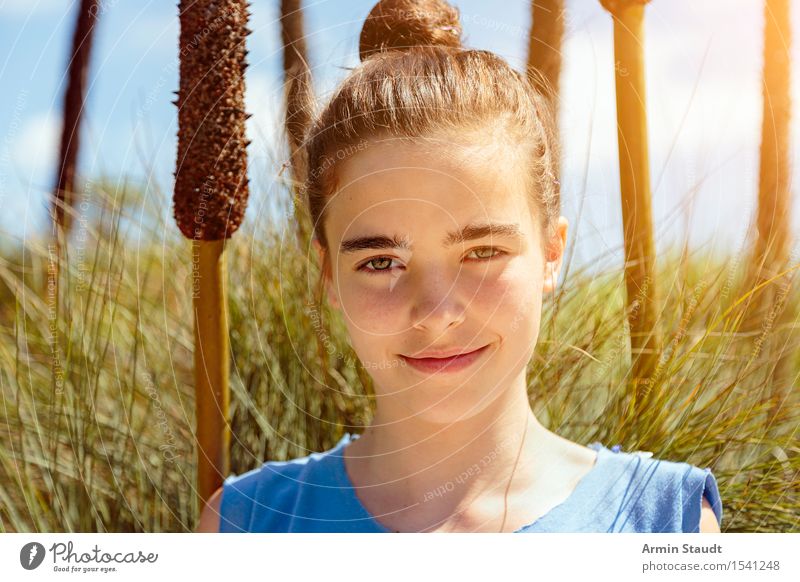 smiling young woman standing in the reeds Lifestyle Style pretty Healthy Harmonious Contentment Human being Feminine Young woman Youth (Young adults) 1
