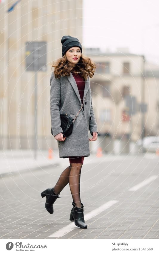 Woman standing on the street - a Royalty Free Stock Photo from