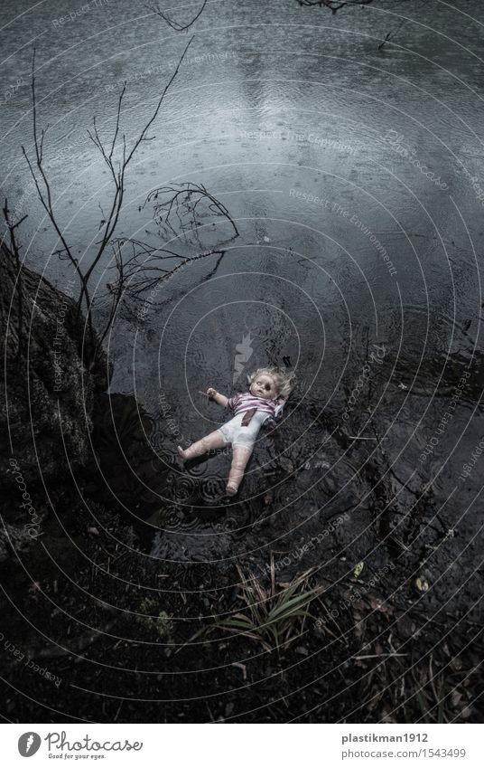 a doll Girl Body Water Drops of water Rain Tree Leaf Lake Toys Doll Fear Dramatic Childhood memory Old Sadness Loneliness Dark Reflection Float in the water