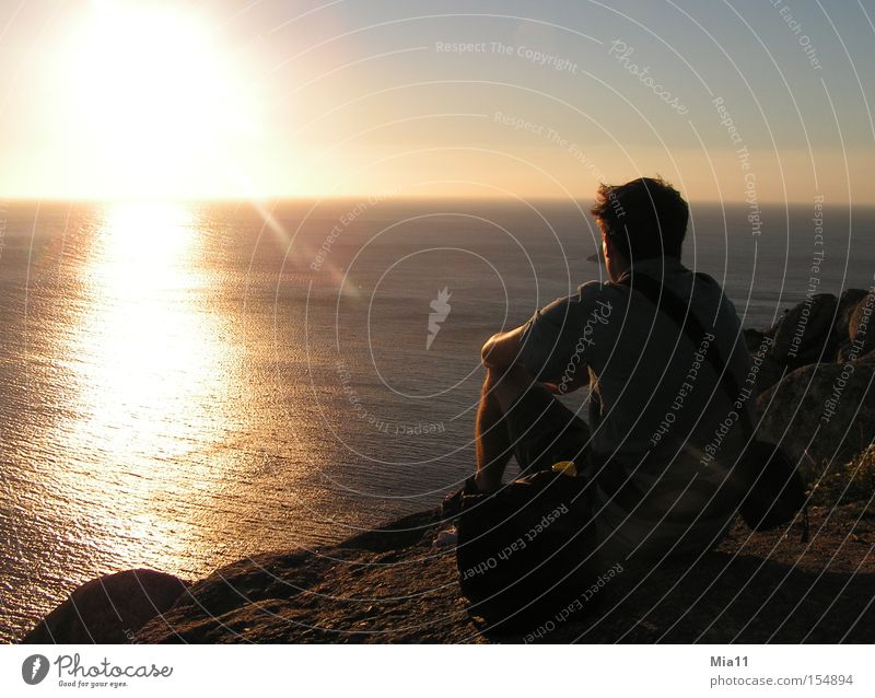 At the end of the world Spain Ocean Sun Sunset Rock Human being Man Observe Water Light Cliff Evening Twilight Summer Celestial bodies and the universe
