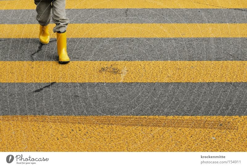 Road safety Pedestrian crossing Zebra crossing Yellow Street Transport Going Traverse Boots Child Boy (child) Student Kindergarten teacher