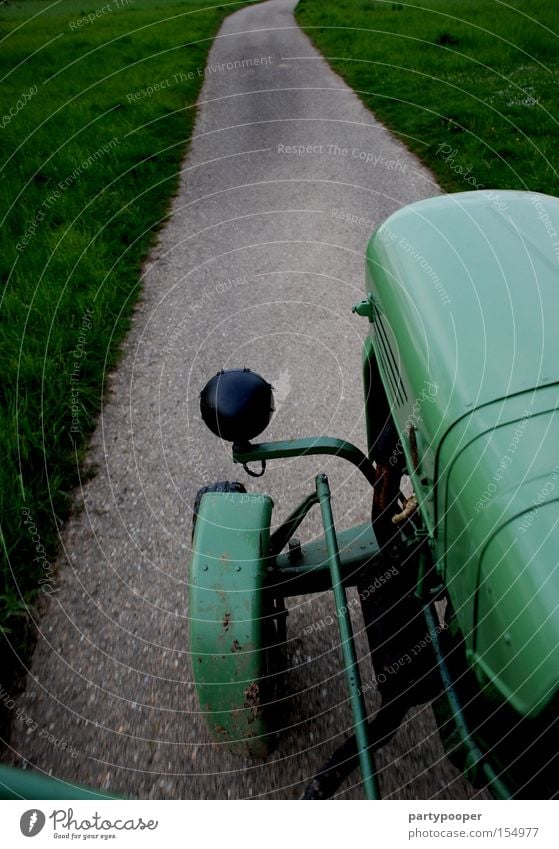 Favourite tractor Green Street Lanes & trails Tractor Tractor wheel Vintage car Asphalt Speed Engines Tire Gray Grass Industry Motorsports driver's perspective