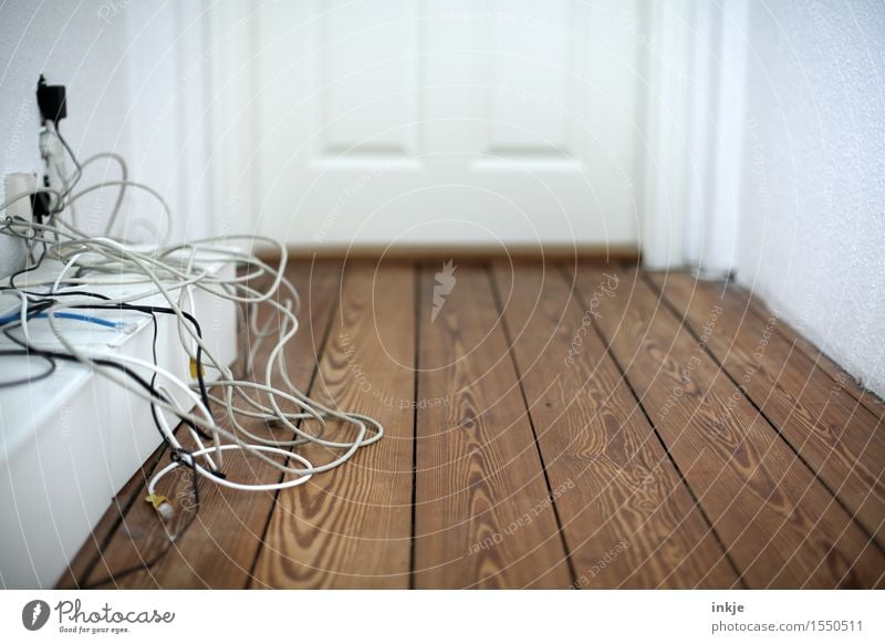 Cable spaghetti in the hallway Living or residing Wooden floor Wooden door Hallway Terminal connector Telecommunications Deserted Chaos Untidy Muddled