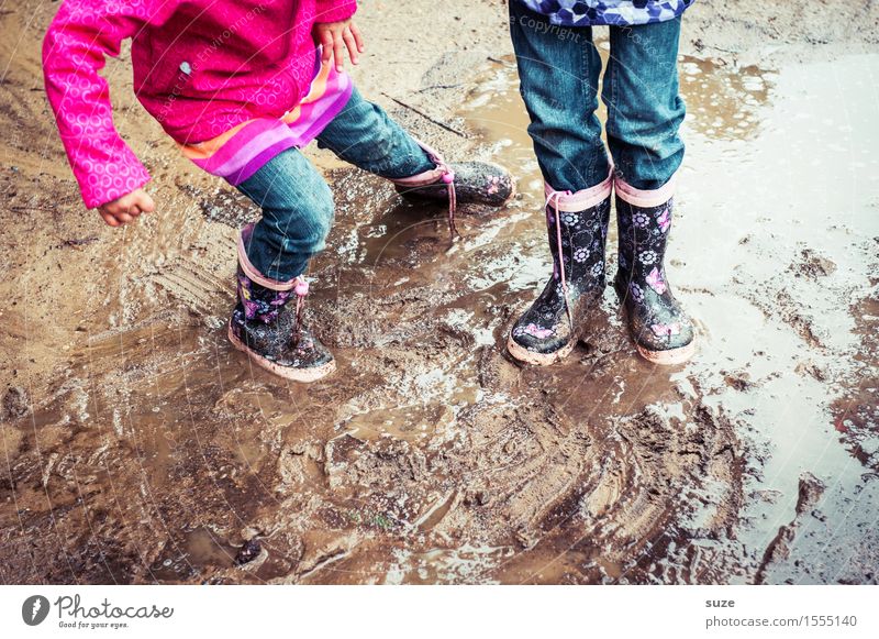 Little mess Joy Leisure and hobbies Playing Child Human being Infancy Legs Feet 2 3 - 8 years Earth Autumn Weather Bad weather Rain Fashion Clothing Pants