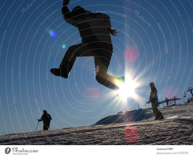 Walking on sunshine Sun Winter Vacation & Travel Skiing Joy Jump Go up Go crazy Snow Sports Playing Flying Back-light Sunbeam Blue sky Cloudless sky Applause