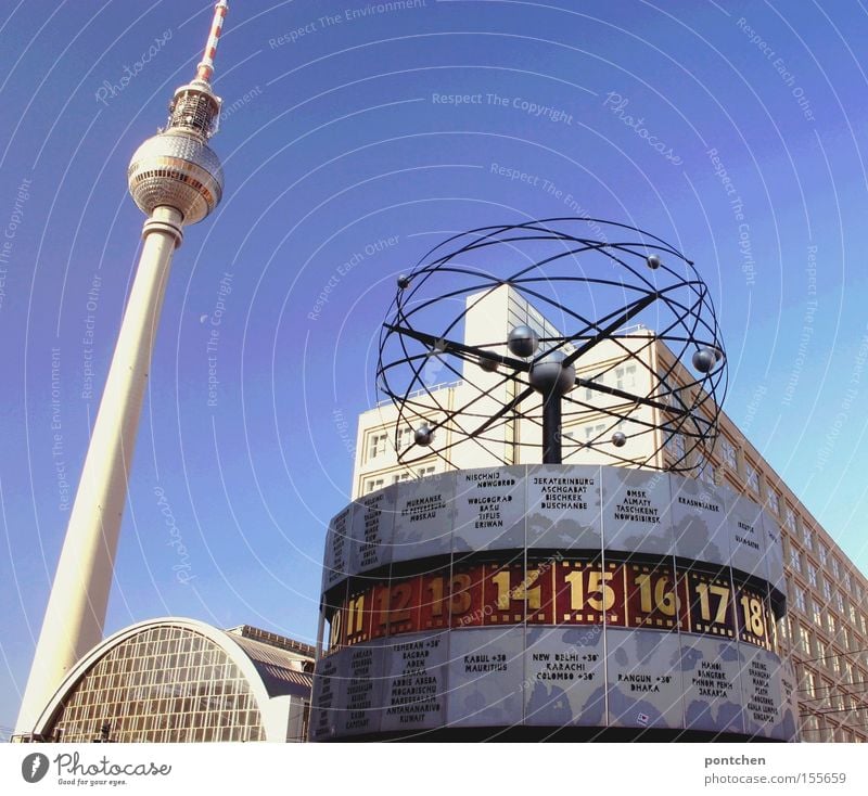 Berlin Alexanderplatz with television tower and world time clock in front of a blue sky Earth Town Capital city Landmark Monument Digits and numbers Time