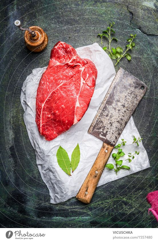 piece of raw meat on white paper with cleaver Food Meat Herbs and spices Nutrition Lunch Organic produce Diet Knives Healthy Eating Table Kitchen Restaurant