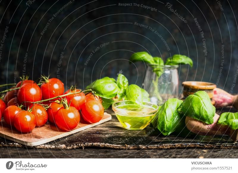 Cherry tomatoes with oil and basil on the kitchen table Food Vegetable Lettuce Salad Herbs and spices Cooking oil Nutrition Lunch Dinner Buffet Brunch