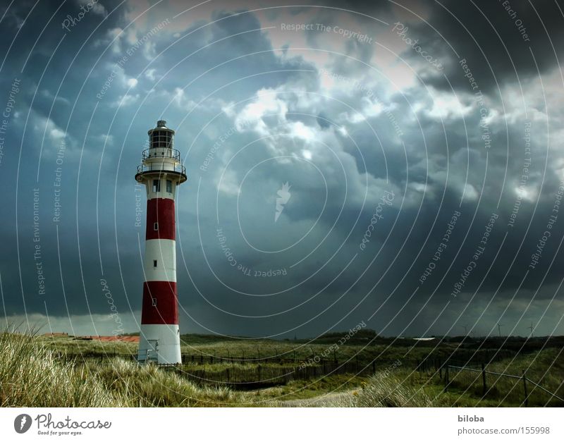 In the middle of the storm Light Clouds Climate Weather Gale Rain Thunder and lightning Coast North Sea Tower Lighthouse Architecture Landmark Monument Red