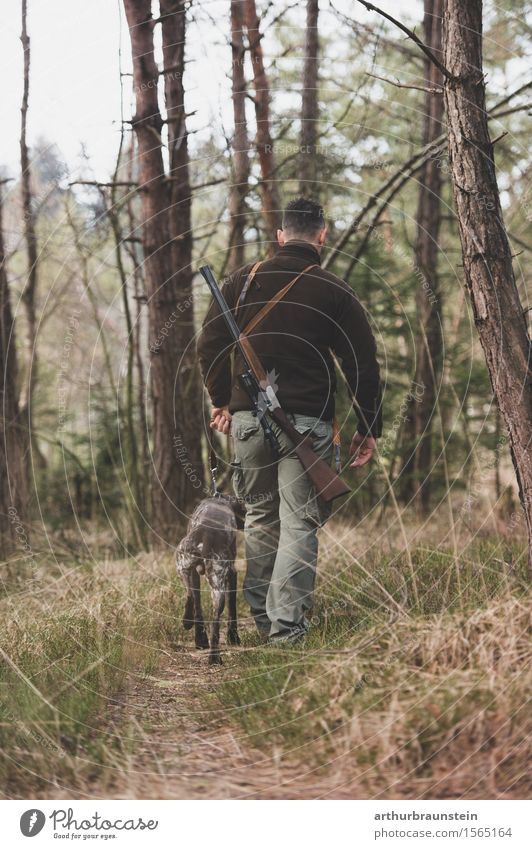Young hunter with rifle and his hunting dog walking in the forest Leisure and hobbies Hunting Trip Hiking Human being Masculine Young man Youth (Young adults)