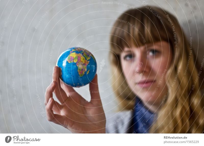 young woman holding a globe Human being Feminine Woman Adults 1 18 - 30 years Youth (Young adults) Environment Concrete Sign Globe Responsibility Attentive
