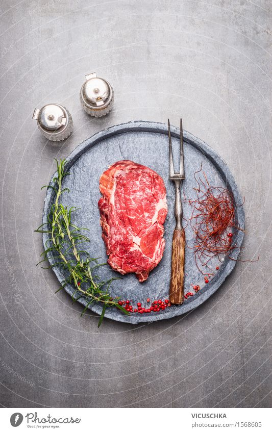 Ribeye steak raw with spices Food Meat Herbs and spices Nutrition Lunch Dinner Picnic Organic produce Plate Fork Style Healthy Eating Life Table Kitchen