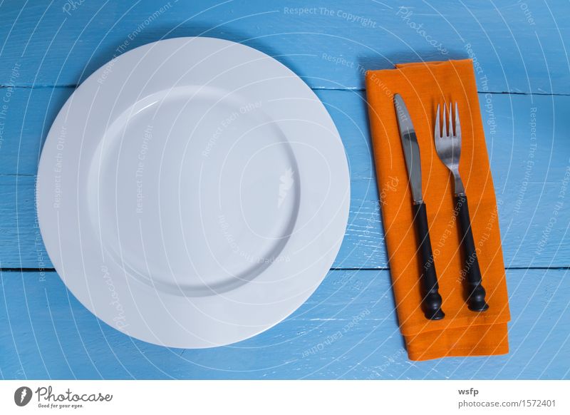 Cutlery and plate on blue wood background Plate Fork Kitchen Restaurant Gastronomy Old Blue Empty Napkin Knives Wooden board Orange Wooden table Wooden sign