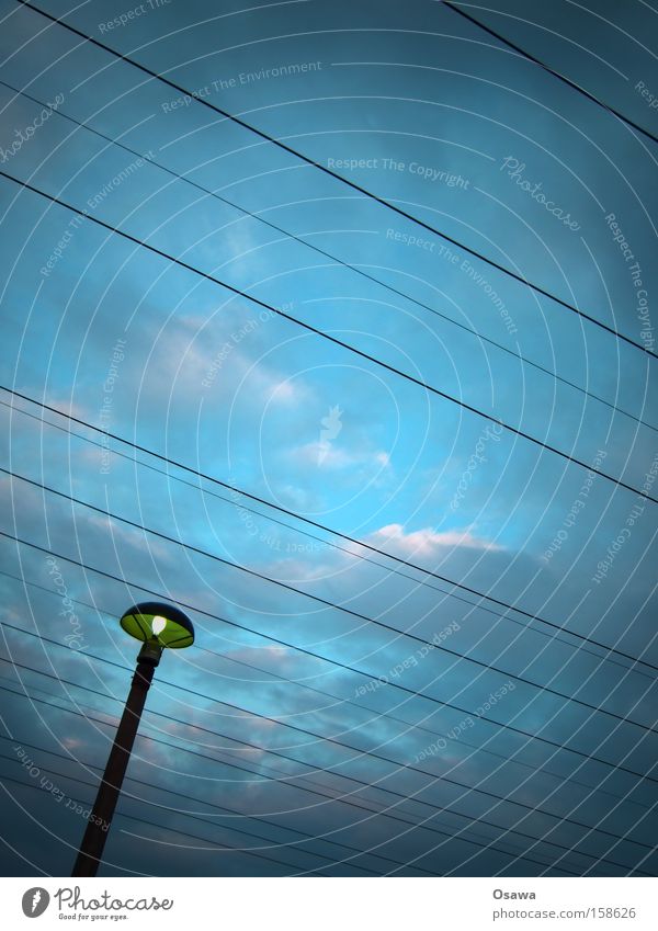 ,\\ Lantern Street lighting Electricity pylon Cable Steel cable Transmission lines Overhead line High-power current Sky Clouds Blue Twilight Evening Line East
