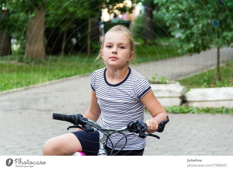 Cute girl driving bicycle in summer Summer Child Schoolchild Girl Woman Adults Infancy 8 - 13 years Autumn Blonde Driving White roller Ice-skates kid six 7