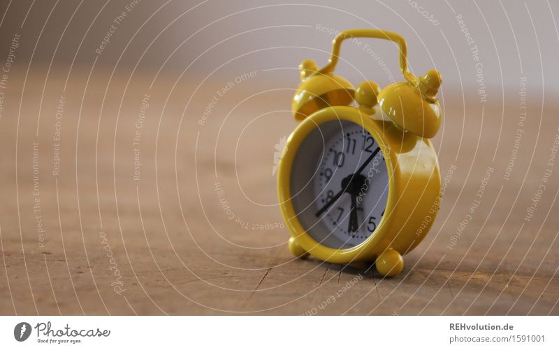 Around the clock. Clock Old Speed Time Alarm clock Clock hand Slowly Yellow Small 6 Arise Period of time Wood Table Colour photo Interior shot Detail Day