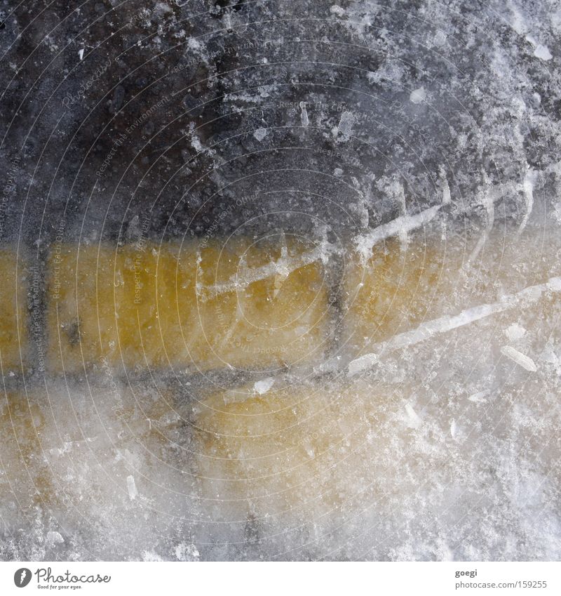 Ice (park) field Winter Frost Traffic infrastructure Signs and labeling Line Freeze Firm Cold Wet Yellow Black White Parking lot Tracks Skid marks Colour photo