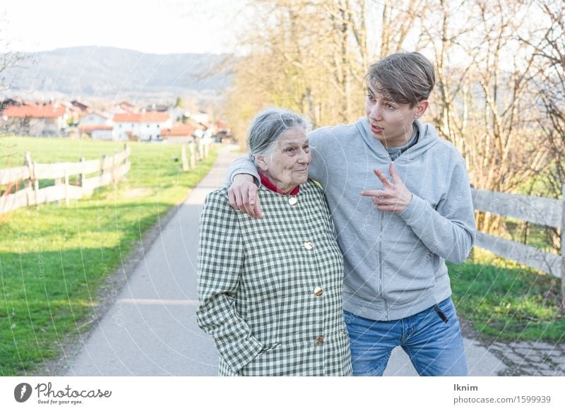 young man and old woman talking during a walk Health care Care of the elderly Young man Youth (Young adults) Female senior Woman Grandmother Family & Relations
