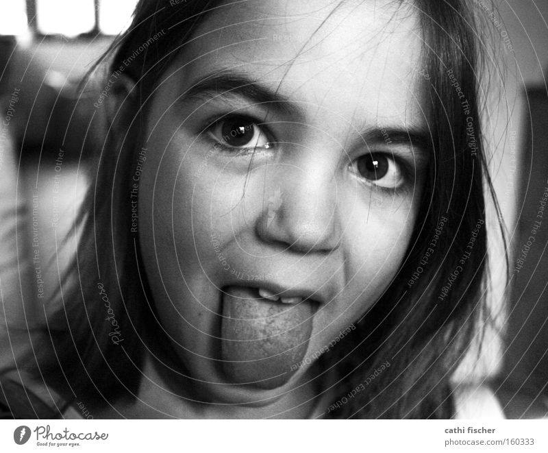 little witch Girl Child Tongue Face Eyes Hair and hairstyles Portrait photograph Nose Joy Brash Funny Grimace Gray Black & white photo snot-nosed nose Infancy