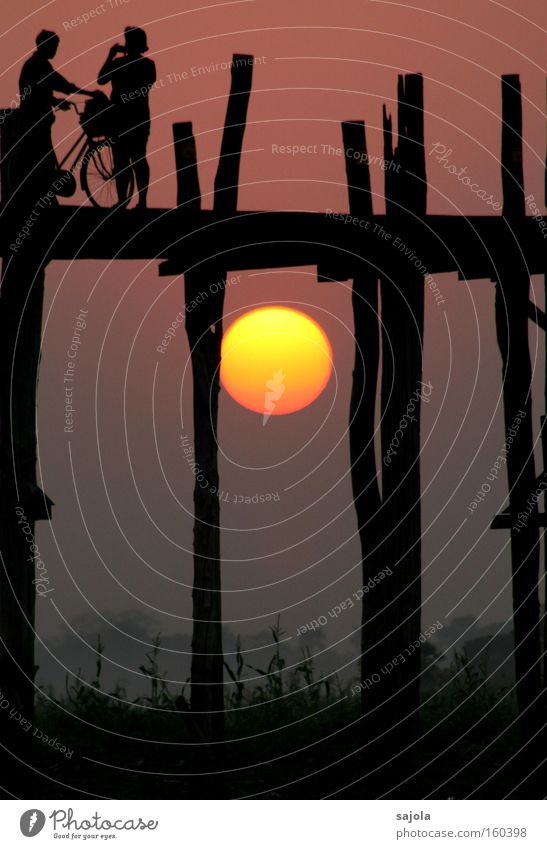 silhouettes before glowing sun Vacation & Travel Tourism Adventure Sun Bicycle Human being 2 Myanmar Asia Bridge Esthetic Yellow Beautiful Exotic Moody Sunset