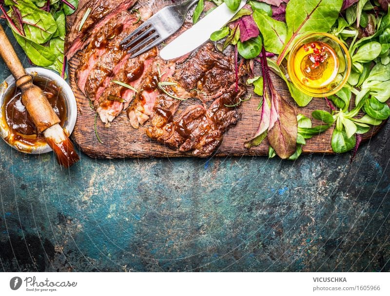 Grilled steak served with green salad and barbecue sauce Food Meat Lettuce Salad Nutrition Dinner Banquet Picnic Bowl Cutlery Style Healthy Eating Table Kitchen