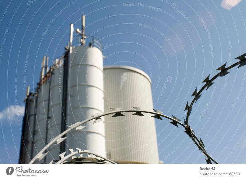 barbed wire töns Barbed wire Wire Industry Works Rescue Barrier Safety Round White Blue Beautiful weather Exterior shot Work and employment Building