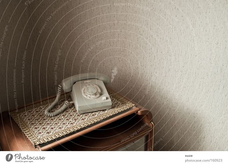 Ring a bell? Living or residing Flat (apartment) Telecommunications Telephone Old Retro Contact Past GDR Iconic Rotary dial Corner of the room Wall (building)