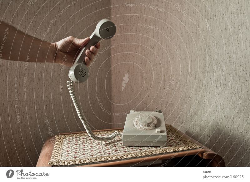 It's for you! Living or residing Flat (apartment) Telecommunications To talk Telephone Arm Hand To hold on Communicate To call someone (telephone) Old Retro