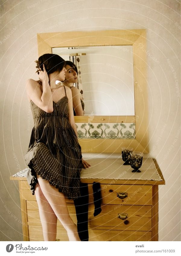 In the mirror Furniture Mirror Human being Feminine Young woman Youth (Young adults) Woman Adults 1 Clothing Dress Sit Cupboard Colour photo Interior shot Day