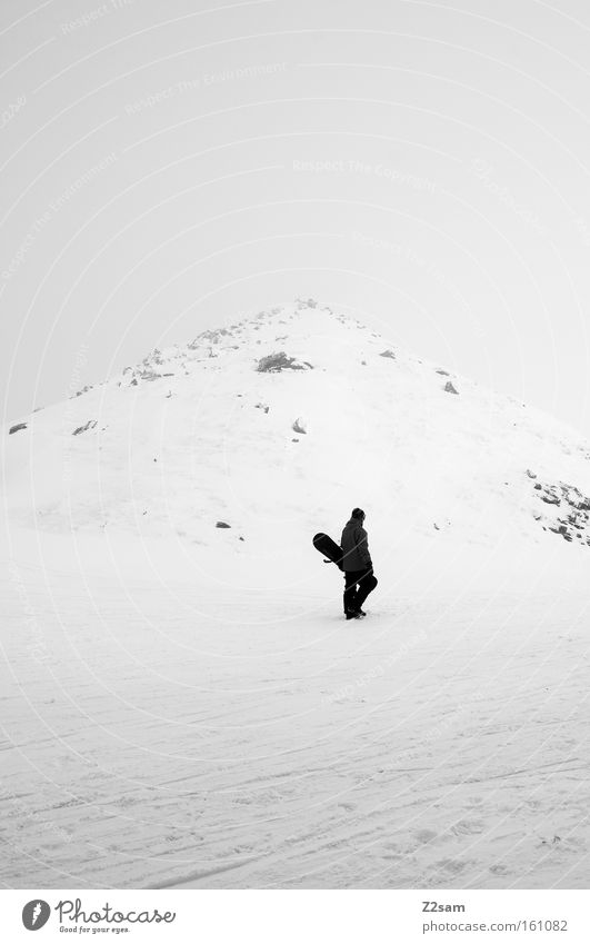 The last Mohican Winter Snowboard White Loneliness Last Winter sports Black Mountain Austria Dark Peak Stone Human being hillock Walking Carrying Upward Ski run