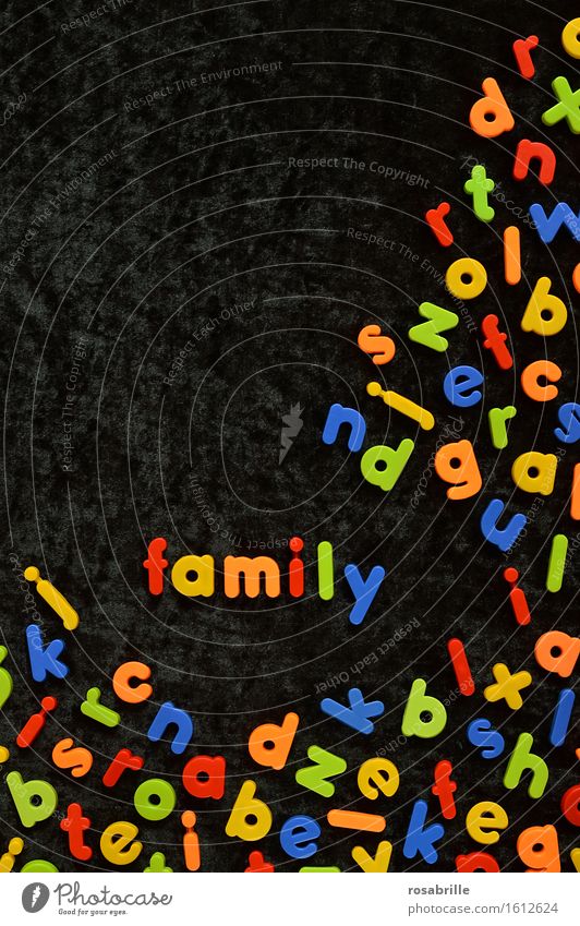 colourful family - colourful magnetic letters on black velvet with the word FAMILY in between Joy Playing Children's game Parenting Education Kindergarten