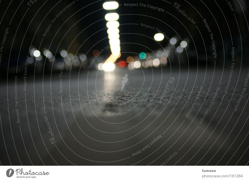 The loneliness of the street Traffic infrastructure Street Car Driving Dark Cold Town Gray White Asphalt Street lighting Motor vehicle Car headlights