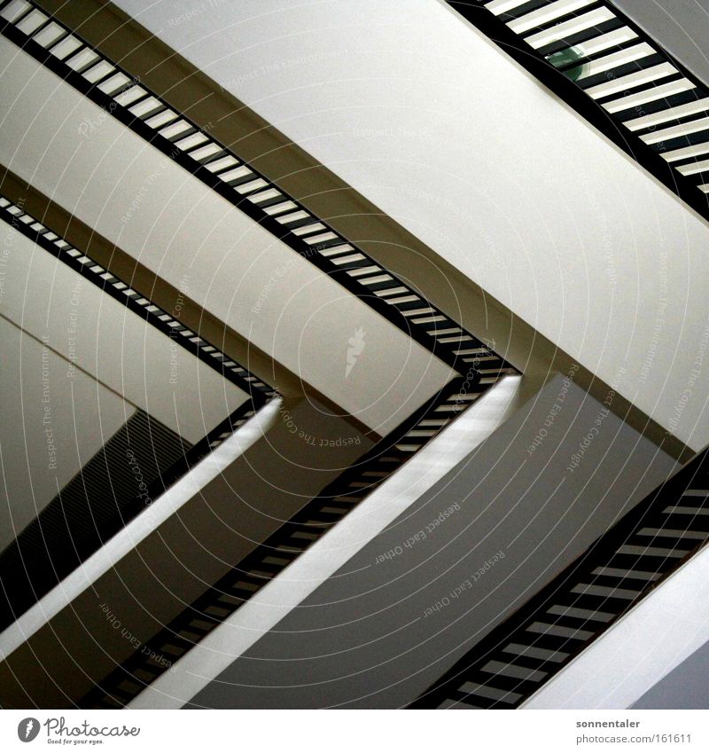 stairtrap Staircase (Hallway) Corridor Handrail Banister Stairs Hold Arrangement Triangle Descent Go up Structures and shapes Line Detail Black & white photo