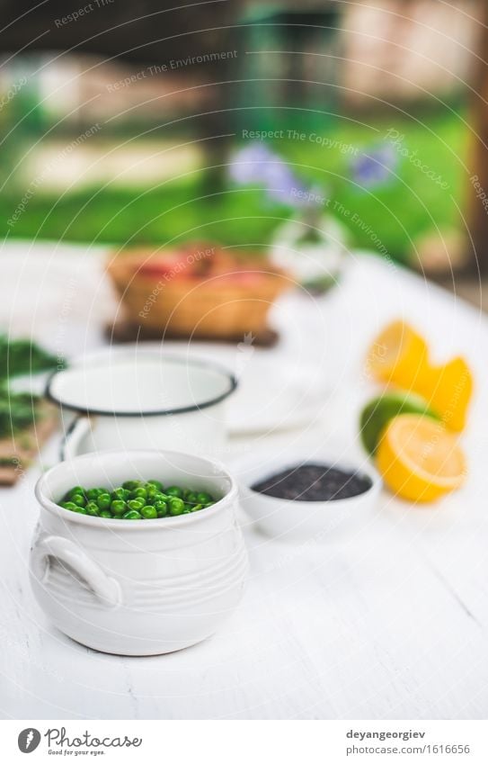 Peas in a bowl on white wooden table Vegetable Vegetarian diet Bowl Table Group Plant Wood Fresh Natural Green White background food agriculture seed Organic