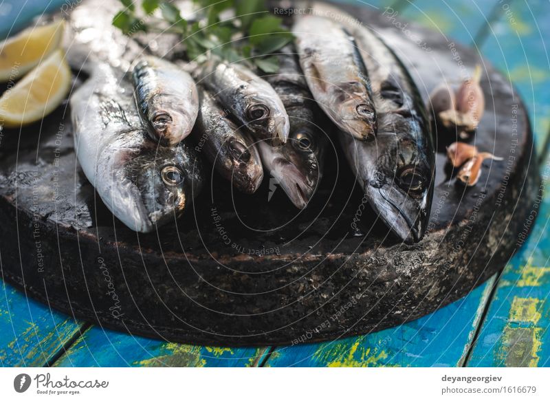 Raw fish. Sea bream, sea bass, mackerel and sardines. Seafood Lunch Pan Cook Fresh Blue Black Lemon Fat Mackerel Ingredients Sardine Meal Dish Exterior shot
