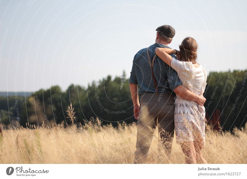 Couple standing in a field in summer looking into the distance Masculine Feminine Partner Adults 2 Human being 30 - 45 years Summer Autumn Beautiful weather