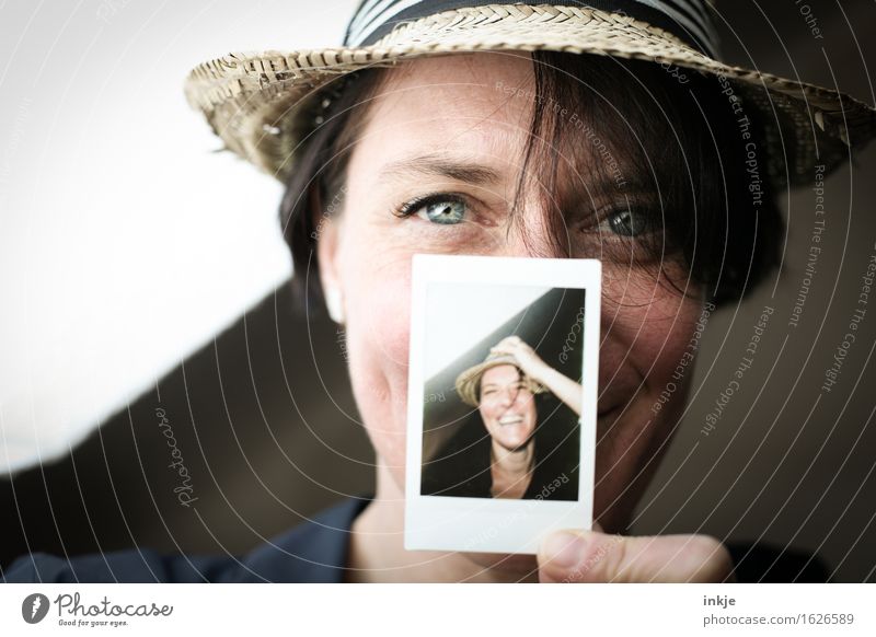 Woman with Polaroid Lifestyle Style Joy Leisure and hobbies Adults Face 1 Human being Hat Straw hat Photography Picture-in-picture Smiling Laughter Friendliness