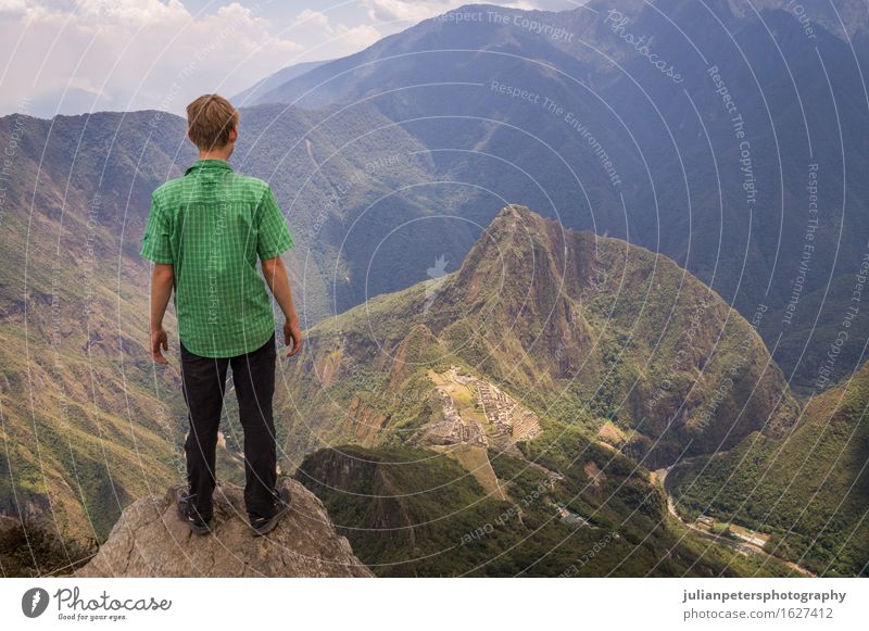 Tourist looking at Machu Picchu Inca city, Peru Vacation & Travel Tourism Mountain Culture Nature Landscape Sky Clouds Rock Town Ruin Street Stone Old Historic