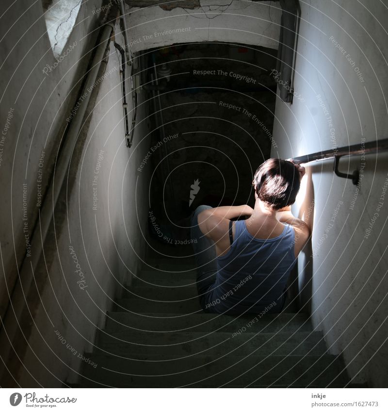 Sad woman sits on basement stairs Living or residing Cellar Cellar stairs Cellar window Woman Adults Life Body Back 1 Human being Crouch Sit Wait Dark Gloomy