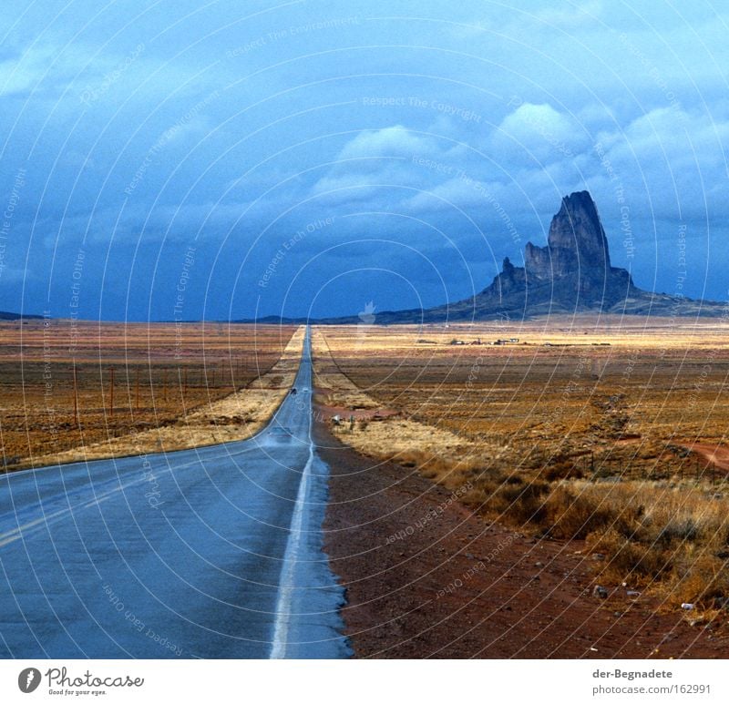 Monument Valley Arizona Street Mountain Rain Clouds Horizon Far-off places Desert Steppe Roadside Vacation & Travel Travel photography Loneliness USA Sky