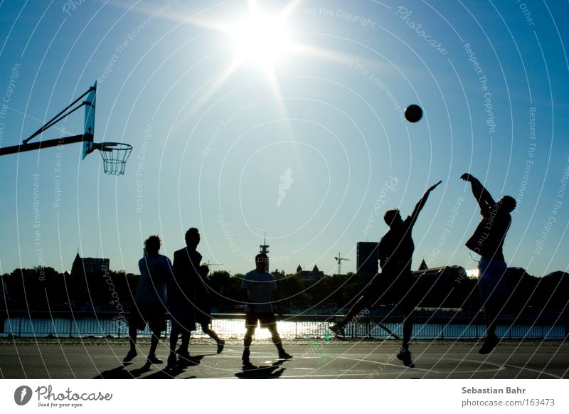 Jumpshot in your Face 6 people Sports Sun Ball Basketball Block Cologne Silhouette Action Blue Sky Spring day Playing Ball sports streetball jumpshot Back-light