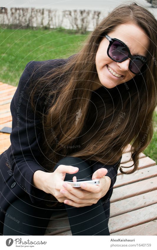 Beautiful business woman with cell phone is laughing Lifestyle Elegant Style SME Career Success Meeting Cellphone Young woman Youth (Young adults) 1 Human being