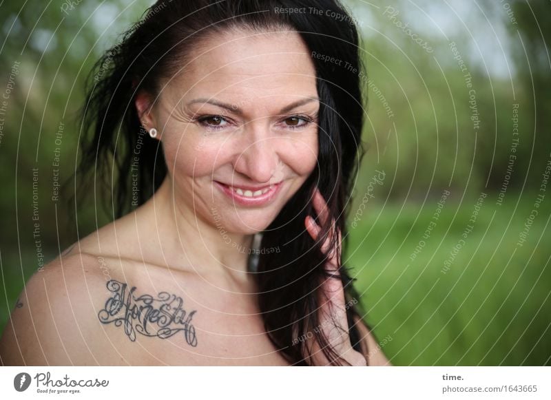 in the park Feminine 1 Human being Landscape Beautiful weather Park Tattoo Black-haired Long-haired Observe Smiling Looking Wait pretty Happiness Contentment