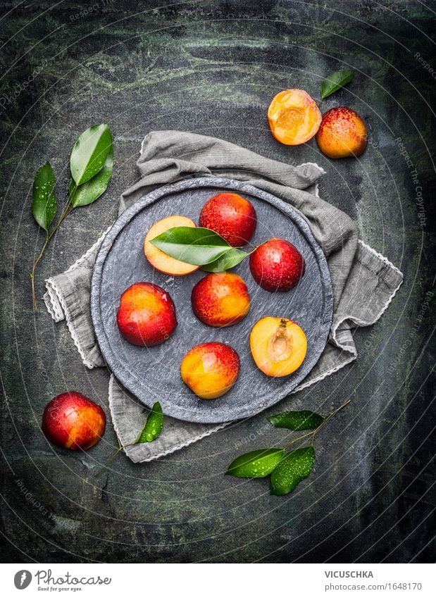 Halved peaches with leaves Food Fruit Nutrition Organic produce Vegetarian diet Crockery Plate Style Design Healthy Eating Life Table Summer Peach Nectarine