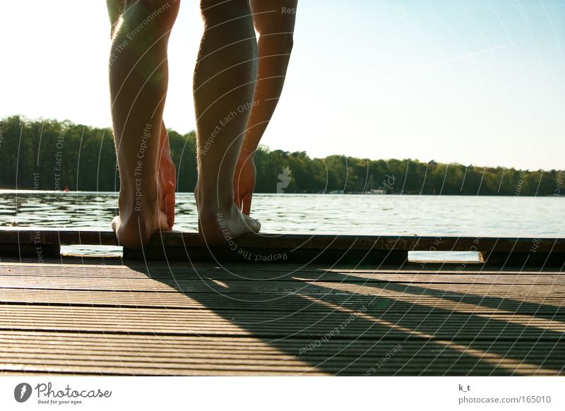 Ready to jump Colour photo Exterior shot Day Shadow Human being Masculine Arm Legs 1 Summer Beautiful weather River bank Havel Jump Stand Wait Athletic Joy