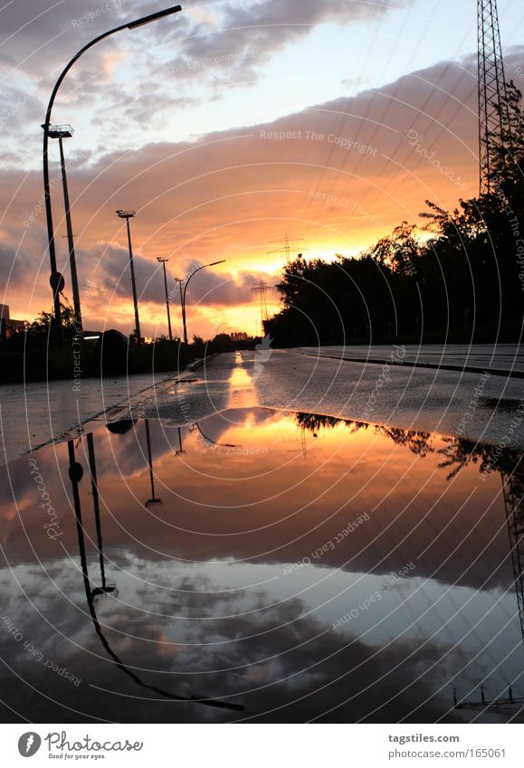 open parenthesis Reflection Water reflection Sun Sunlight Lantern Hamburg Puddle Mathematics arithmetic operation Holder Above Symmetry Street Vanishing point