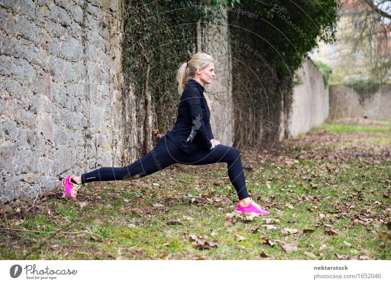 attractive blonde woman exercising in park Lifestyle Body Wellness Sports Human being Woman Adults Park Fitness Athletic Thin Muscular Practice healthy workout