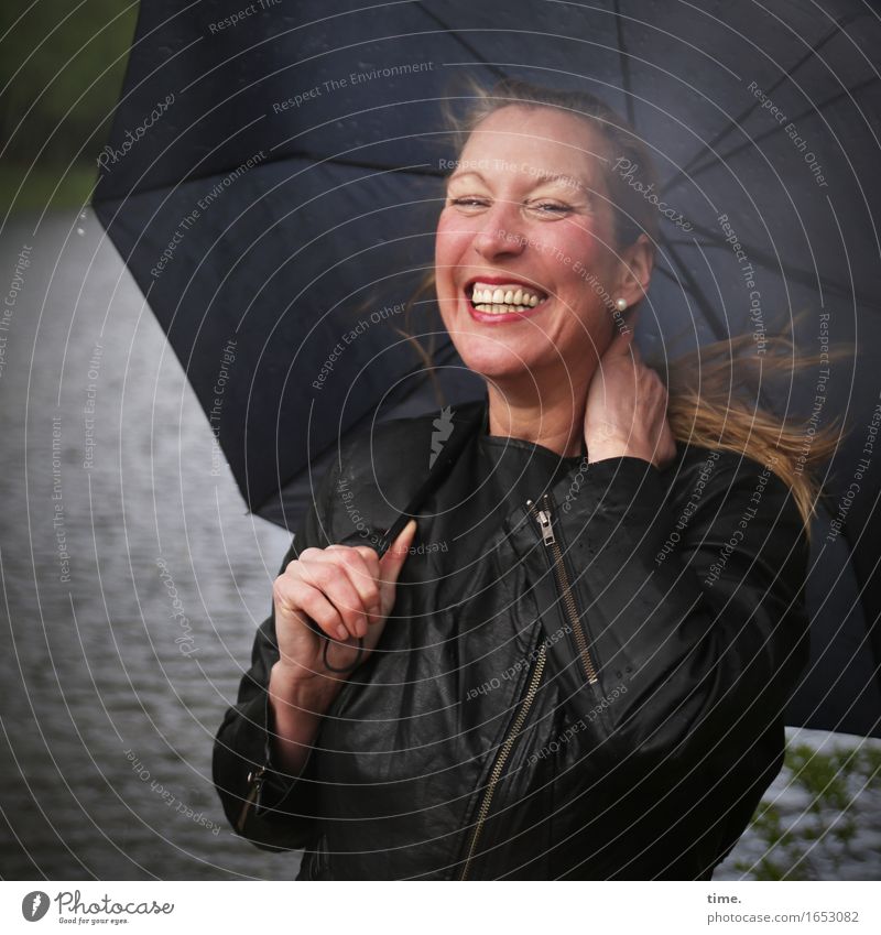 Yvonne - laughing woman with umbrella Feminine 1 Human being Rain Waves coast Jacket Umbrella Blonde Long-haired Observe Relaxation Laughter Looking Wait